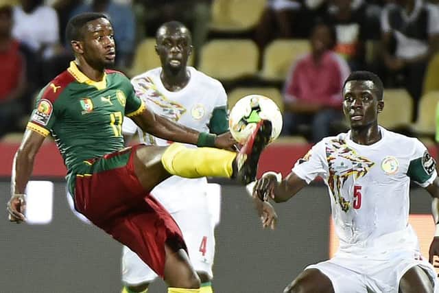 Cameroon No.17 Arnaud Djoum battles for the ball during his teams surprise run to Africa Cup of Nations glory in 2017. Photograph: Khaled Desouki/AFP/Getty