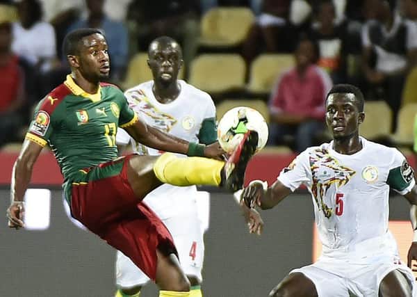 Cameroon No.17 Arnaud Djoum battles for the ball during his teams surprise run to Africa Cup of Nations glory in 2017. Photograph: Khaled Desouki/AFP/Getty