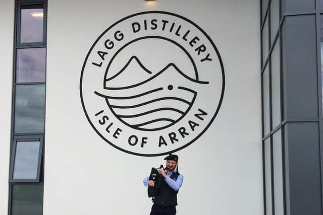 Robbie Adamson, who is part of the visitor centre team, pipes in the guests.