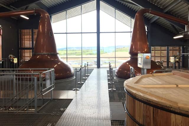 The still room houses two copper potstills, the wooden washbacks and the mash tun.