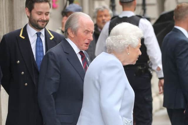 Sir Jackie Stewart was pictured escorting the Queen to her car. Picture: PA