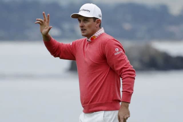 Justin Rose acknowledges the crowd after signing off with three straight birdies in the opening round at Pebble Beach in California. Picture: Getty Images