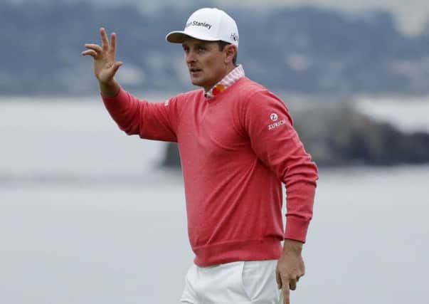 Justin Rose acknowledges the crowd after signing off with three straight birdies in the opening round at Pebble Beach in California. Picture: Getty Images