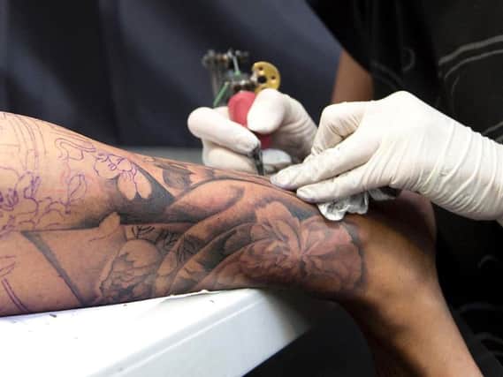Almost a fifth of those who had tattoos or piercings suffered side effects. Picture: PA