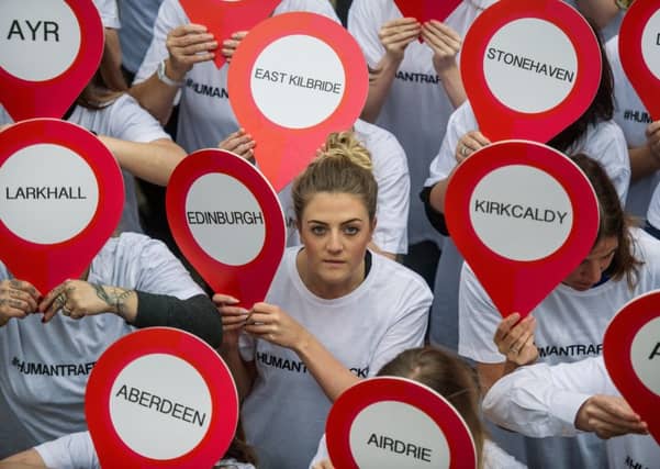 A protest on Glasgow's Buchanan Street steps against human trafficking.
Picture: John Devlin