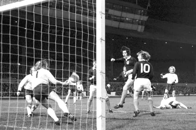 Jim Holton, centre, scores with a header for Scotland against West Germany in a pre-World Cup friendly in 1973. Picture: Allan Milligan