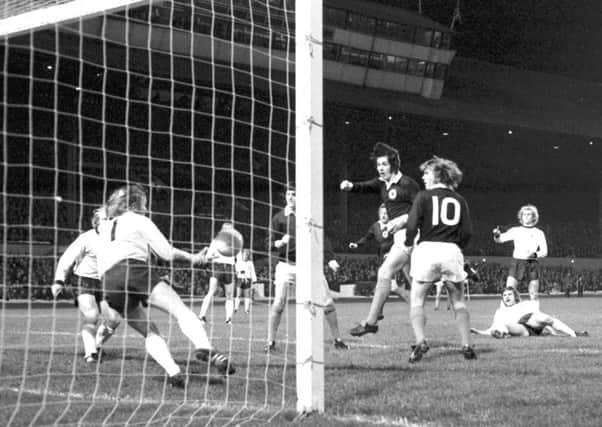 Jim Holton, centre, scores with a header for Scotland against West Germany in a pre-World Cup friendly in 1973. Picture: Allan Milligan