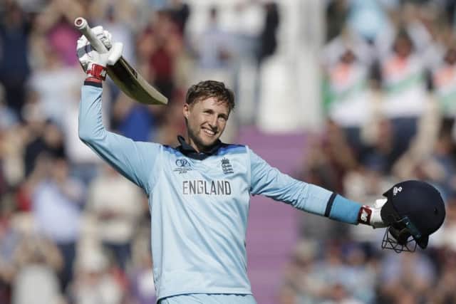 Joe Root celebrates reaching his second century of the tournament as England eased to an eight-wicket victory over the West Indies. Picture: AP.