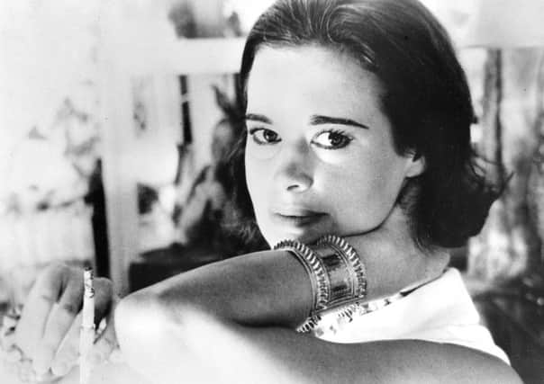 Railroad heiress Gloria Vanderbilt poses for a photograph. Vanderbilt, the intrepid heiress, artist and romantic who began her extraordinary life as the "poor little rich girl" of the Great Depression, survived family tragedy and multiple marriages and reigned during the 1970s and '80s as a designer jeans pioneer, died Monday, June 17, 2019,  at the age of 95.  (AP Photo, File)