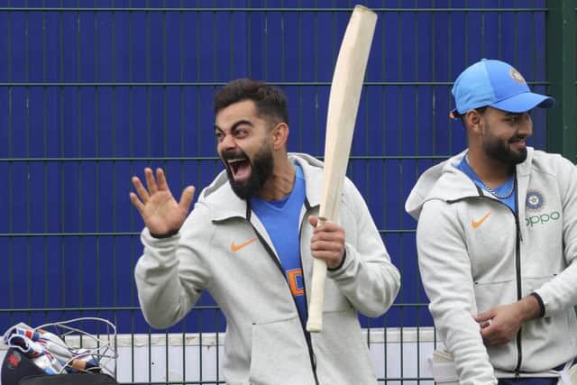Captain Virat Kohli enjoys Indias training session at Old Trafford in Manchester.  Photograph: Aijaz Rahi/AP