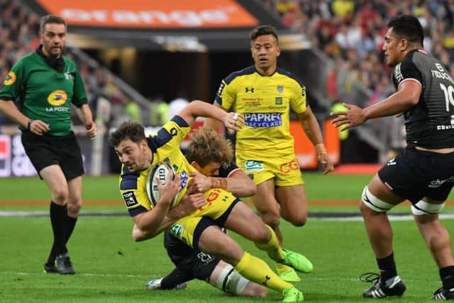 Clermont scrum-half Charlie Cassang is tackled by Toulouse's Richie Gray. Picture: AFP/Getty Images