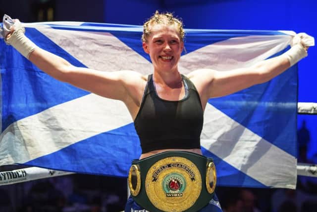 Hannah Rankin with the Saltire and the precious belt she won in Paisley on Saturday. Picture: SNS.