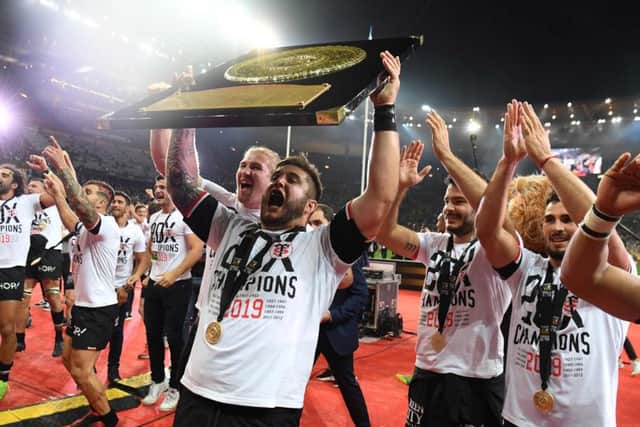 Toulouse players celebrate after victory over Clermont Auvergne clinched the Top 14 title. Picture: AFP/Getty