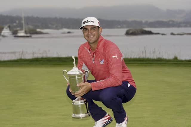Gary Woodland posses with the trophy after winning the 119th US Open at Pebble Beach on the California coast. Picture: AP