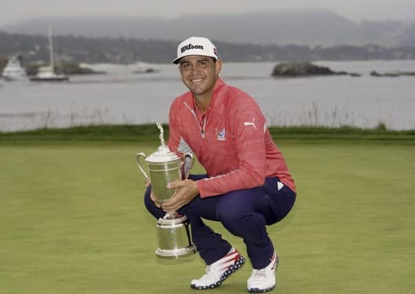 Gary Woodland posses with the trophy after winning the 119th US Open at Pebble Beach on the California coast. Picture: AP