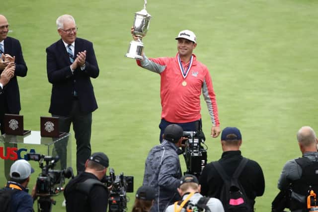 Gary Woodland poses with the US Open trophy following his three-shot victory on Sunday. Picture: Getty.