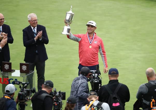 Gary Woodland poses with the US Open trophy following his three-shot victory on Sunday. Picture: Getty.
