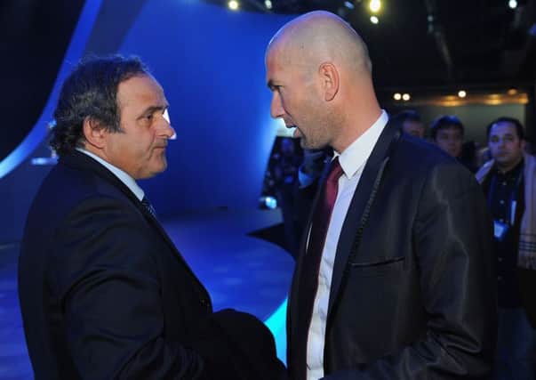 Michel Platini with fellow France legend Zinedine Zidane (Photo by Michael Regan/Getty Images)