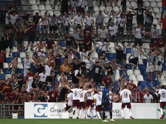 Sarajevo players celebrate a goal in front of their fans in a 2-2 Europa League draw with Atalanta in Italy last year