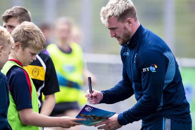 Scotland full-back Stuart Hogg signs an autograph for a fan in Inverness, where Gregor Townsends extended training squad gathered to kick off their preparations for the World Cup. Picture: SNS/SRU
