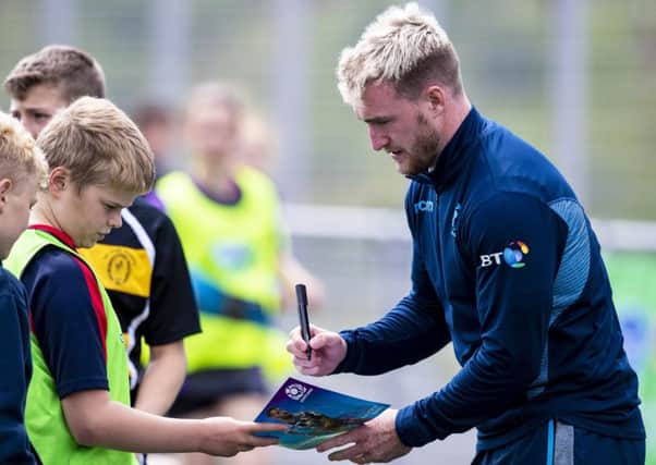 Scotland full-back Stuart Hogg signs an autograph for a fan in Inverness, where Gregor Townsends extended training squad gathered to kick off their preparations for the World Cup. Picture: SNS/SRU