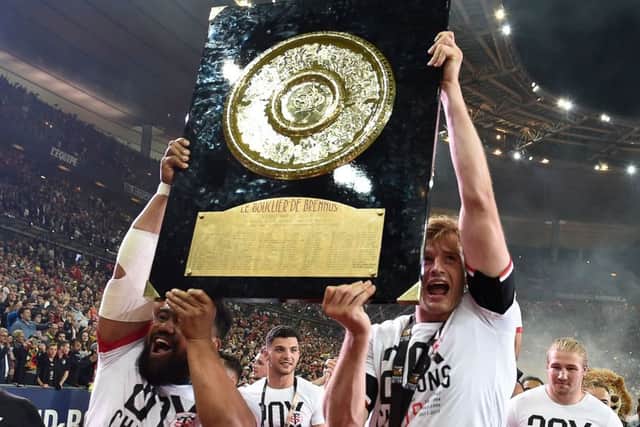Richie Gray, right, hoists aloft the Bouclier de Brennus trophy after helping Toulouse win the French Top 14 final. Picture: AFP/Getty Images