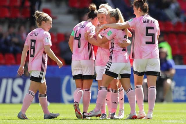 Scotland squad celebrate after Lana Clelland pulls a goal back in the defeat to Japan.