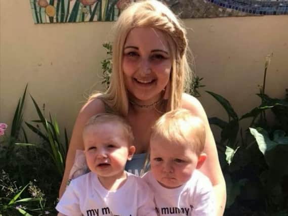 Dionne with her twins. They were just months old when she was diagnosed with cancer. Picture: SWNS
