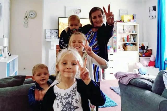 Dionne with her four children after treatment for cancer. Picture: SWNS