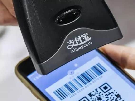 Chinese consumers prefer to pay with mobile payments. Picture: PA
