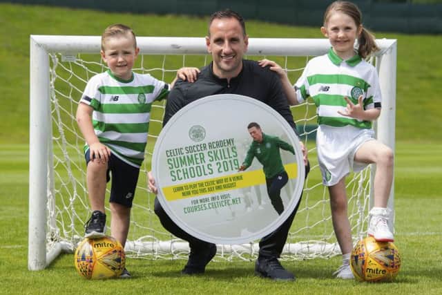 Celtic assistant manager John Kennedy ) promotes the club's summer soccer schools with Max Murray (aged 5, left) and Orla Currie (aged 7).