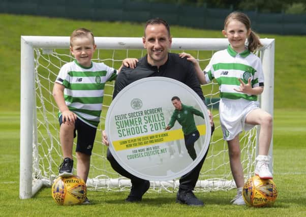 Celtic assistant manager John Kennedy ) promotes the club's summer soccer schools with Max Murray (aged 5, left) and Orla Currie (aged 7).