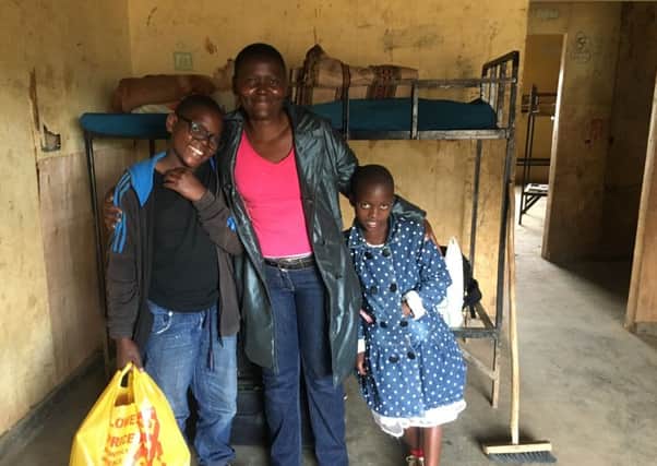 Private school pupil Bill (left) with his mother Debra and his little sister Eliza, settles into his dormitory (Picture: Susan Dalgety)
