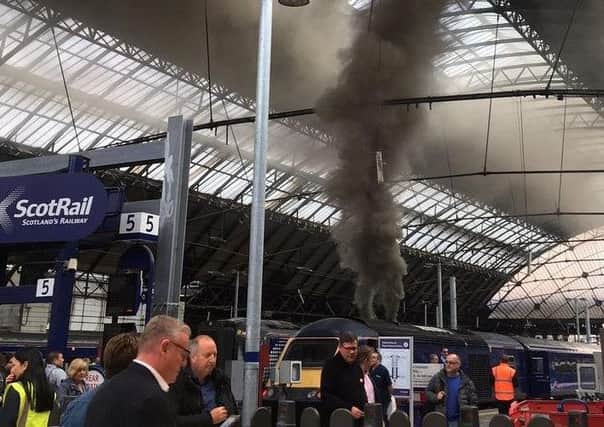 Smoke from the train which triggered fire alarms at Queen Street Station. Picture: Holly Rumble
