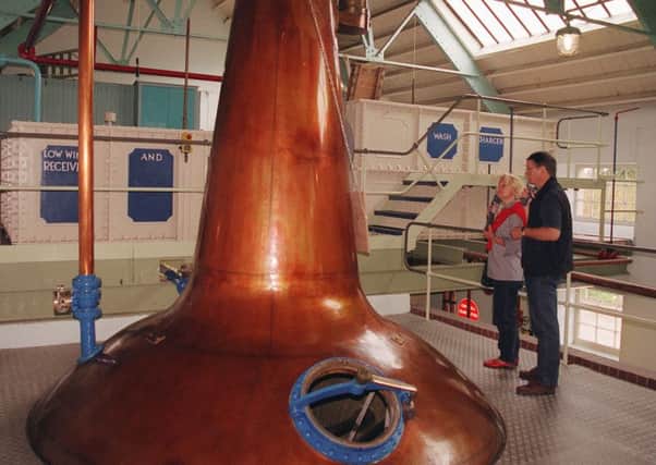 Visits to distilleries are up.  (AP Photo/Fred Seelig)