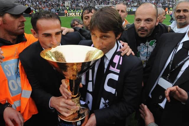 Alessio and Antonio Conte celebrate with the Serie A trophy after clinching the Italian title with Juventus in 2012. Picture: Getty.