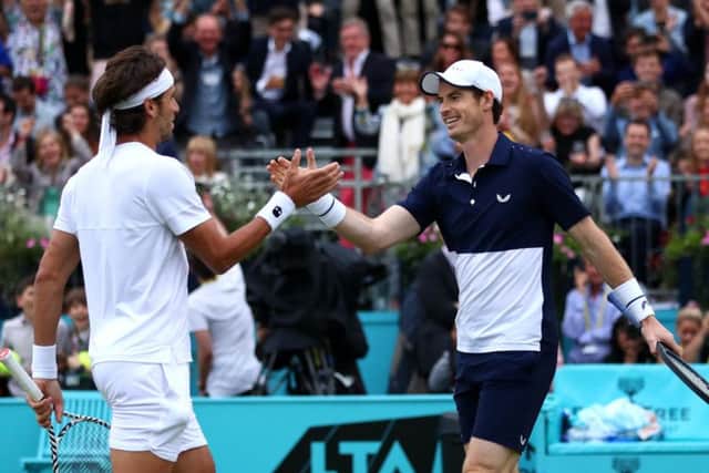Feliciano Lopez, left, and Andy Murray celebrate their win over Juan Sebastian Cabal and Robert Farah of Colombia at Queen's Club. Picture: Clive Brunskill/Getty Images