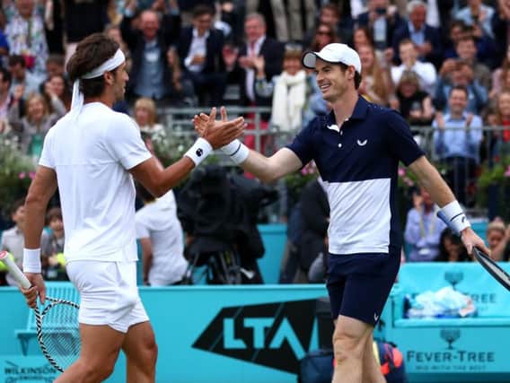 Feliciano Lopez, left, and Andy Murray celebrate their win over Juan Sebastian Cabal and Robert Farah of Colombia at Queen's Club. Picture: Clive Brunskill/Getty Images