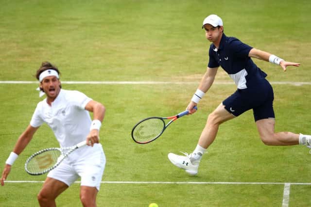 Andy Murray moved freely on court as he teamed up with Feliciano Lopez to beat Colombias Juan Sebastian Cabal and Robert Farah. Picture: Getty.