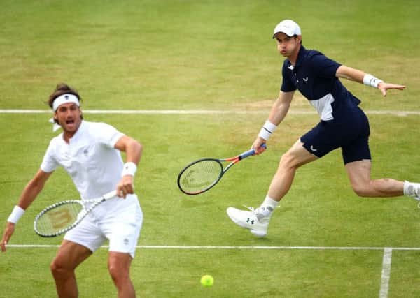 Andy Murray moved freely on court as he teamed up with Feliciano Lopez to beat Colombias Juan Sebastian Cabal and Robert Farah. Picture: Getty.