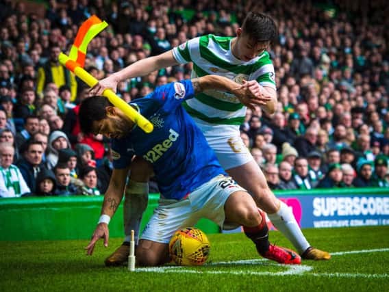 Daniel Candeias battles Kieran Tierney during an Old Firm clash at Celtic Park.
