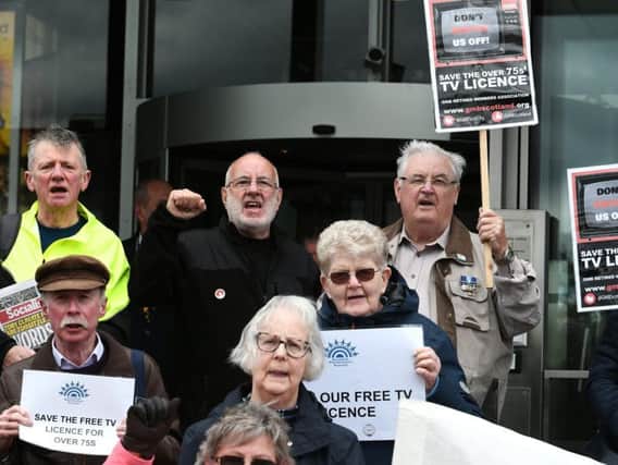 Pensioners gathered outside the BBC's Glasgow offices.