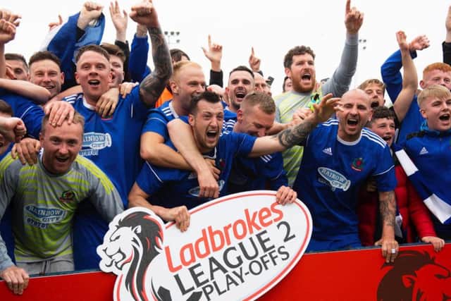 Cove celebrate winning promotion to the SPFL