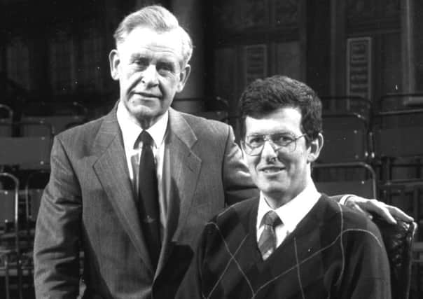 Hamish Cameron poses for a picture in the famous black chair with then Mastermind host Magnus Magnusson in 1990