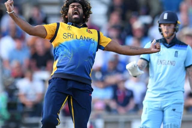 Sri Lanka's Lasith Malinga celebrates taking the wicket of England's Jos Buttler for just 10 runs. Picture: Oli Scarff/AFP