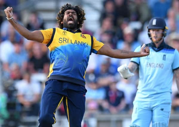 Sri Lanka's Lasith Malinga celebrates taking the wicket of England's Jos Buttler for just 10 runs. Picture: Oli Scarff/AFP