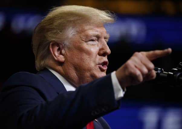 US President Donald Trump is a racist (AP Photo/Evan Vucci)