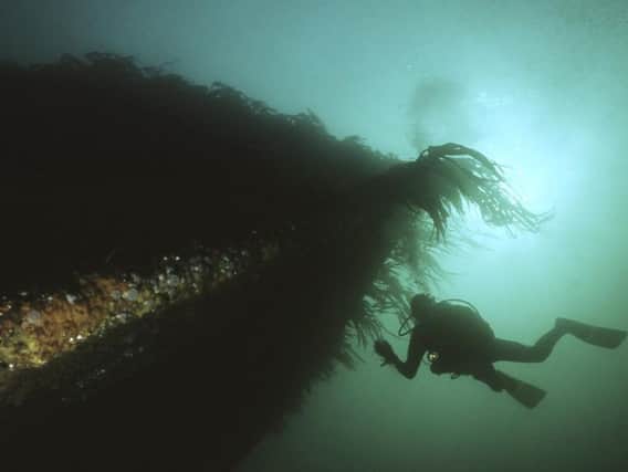 A diver inspects one of the wrecks at Scapa Flow in Orkney.