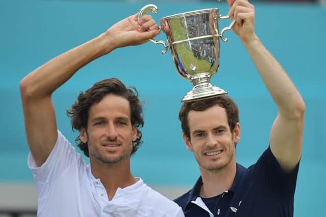 Andy Murray, right, and Feliciano Lopez celebrate their doubles win at Queen's Club. Picture: AFP/Getty Images