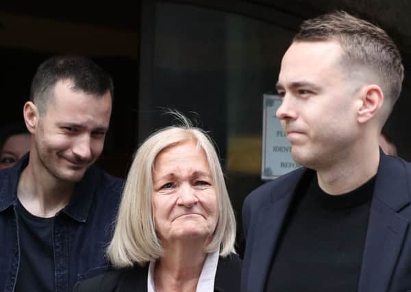 Sally Challen, flanked by her sons James (left) and David (right),  leaves court after hearing she will not face a retrial over the death of her husband Richard Challen in 2010. (Picture: Yui Mok/PA Wire)